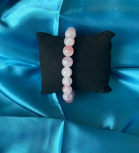 A second photograph of the handmade pink glass bead stretch bracelet