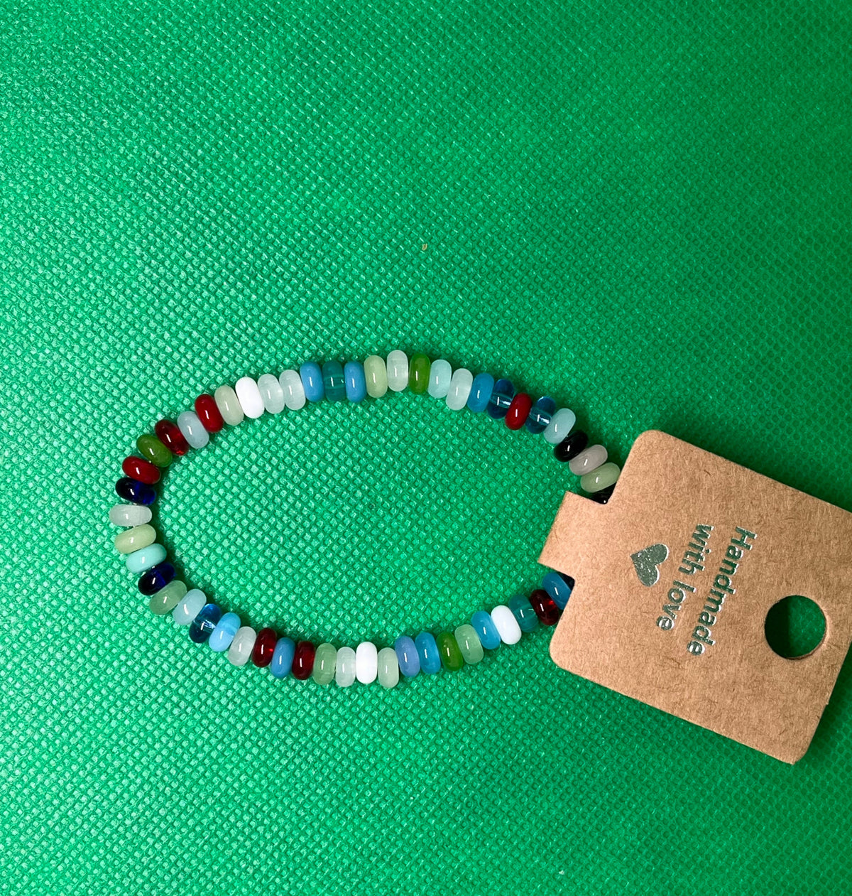 A handmade rainbow abacus bead stretch bracelet