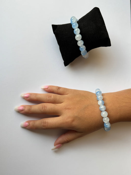 A handmade ocean blue glass bead stretch bracelet