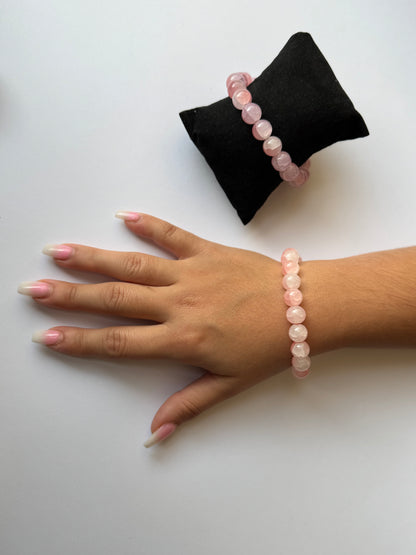 A handmade soft pink glass bead stretch bracelet