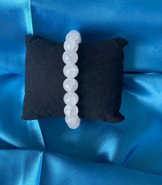 A handmade white glass bead stretch bracelet